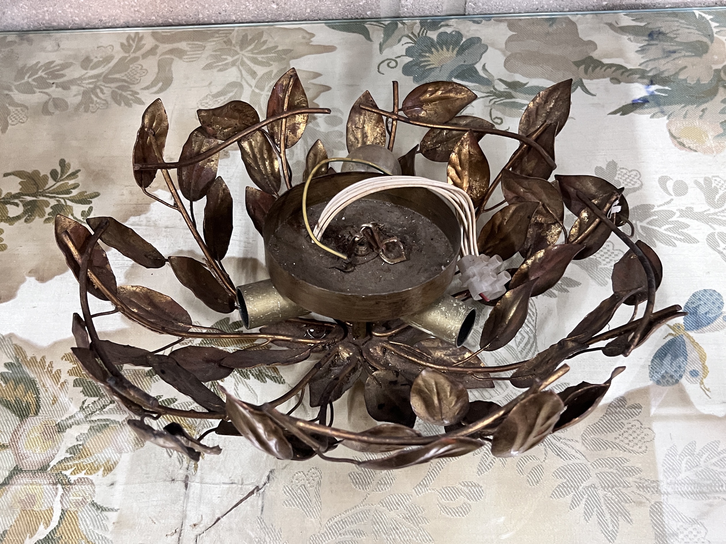 A gilt metal ceiling shade